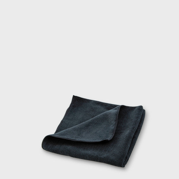 Black microfibre work cloth to scale grey background