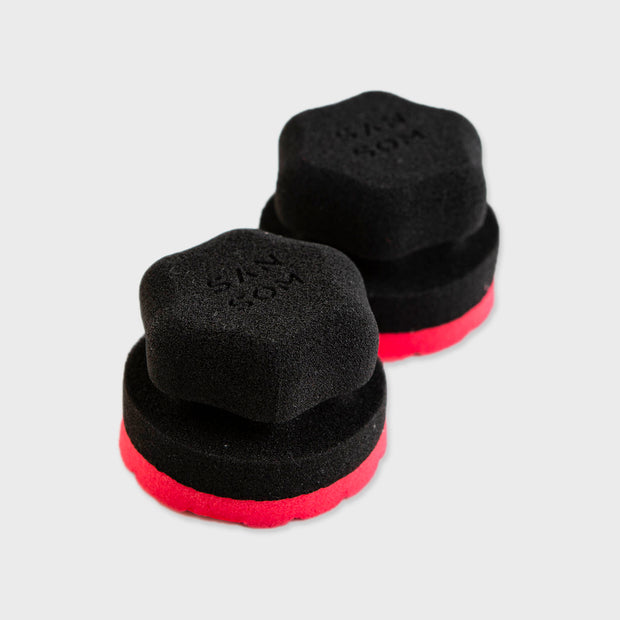 two tyre sponges top view grey background
